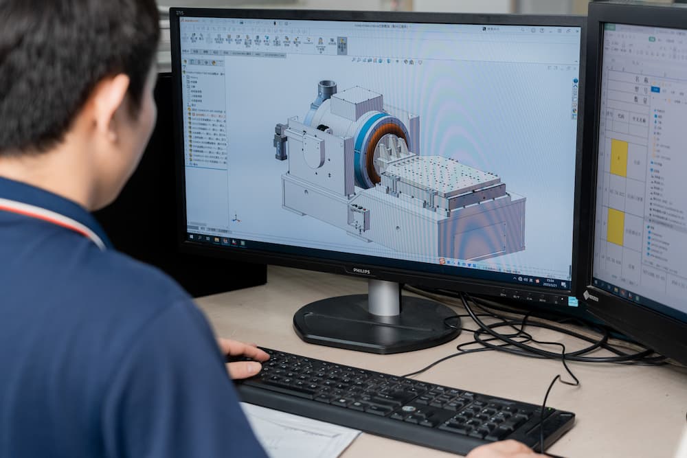 The engineer designs using the computer