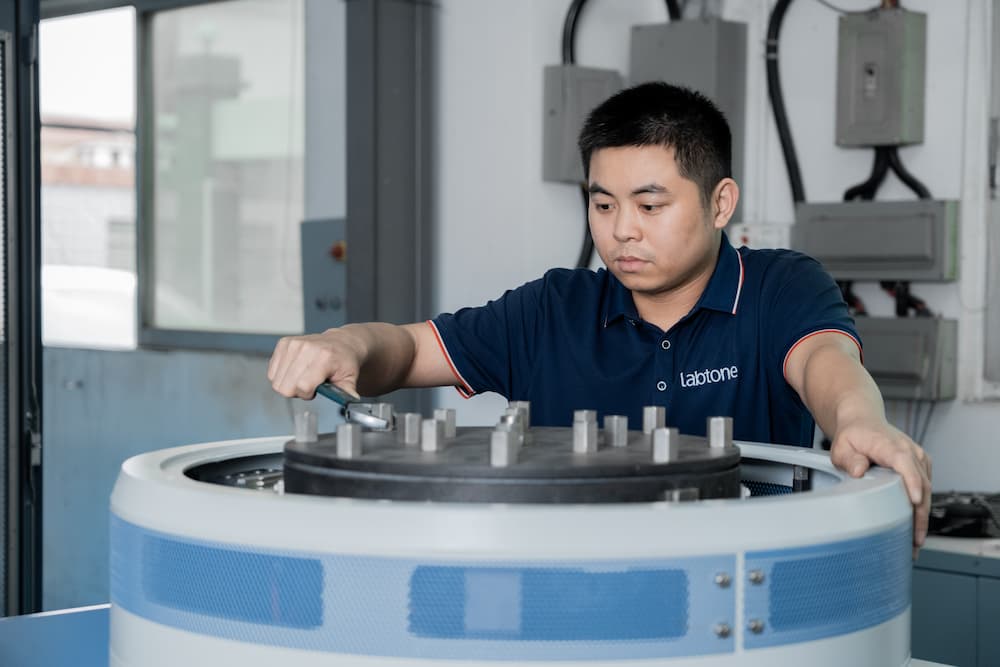 Engineer operates the testing machine